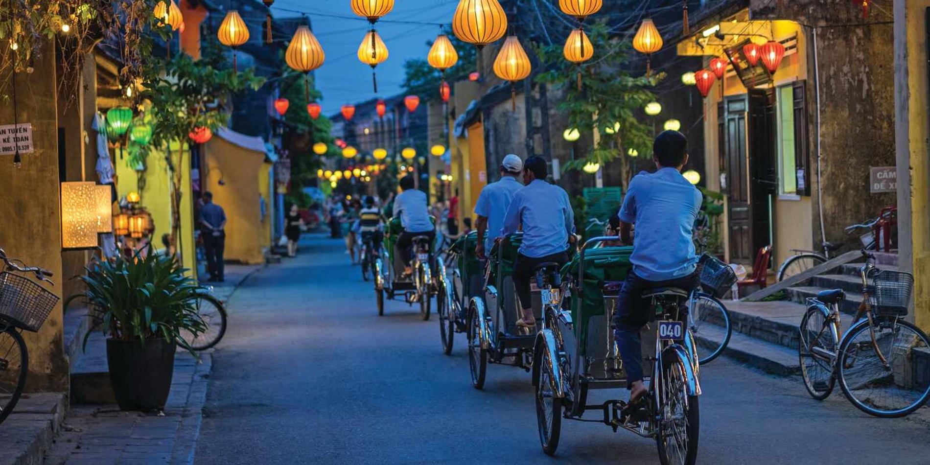 Riding on bikes at night in the streets of Hoi