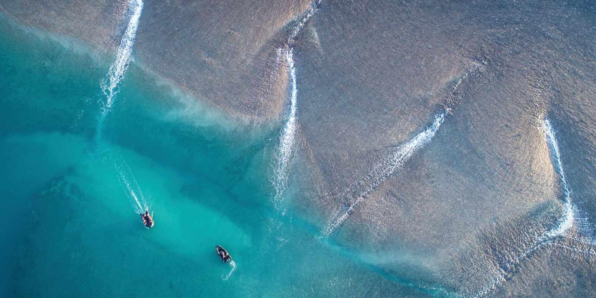 Aerial view of reef and zodiacs, Montgomery Reef