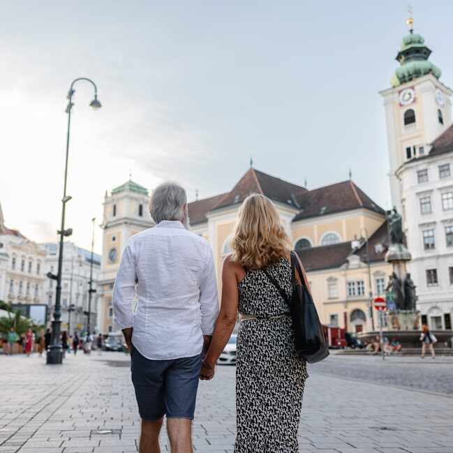 Couple walking hand in hand, Vienna
