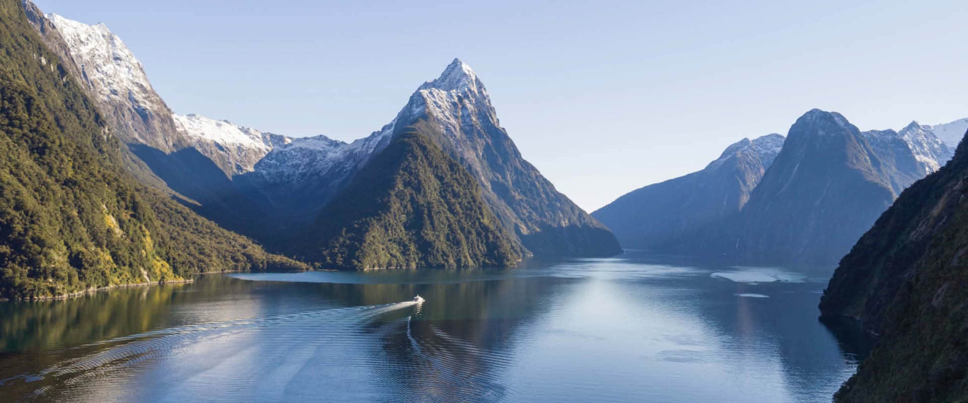 Long distance view of Milford Sound depicting the mountains