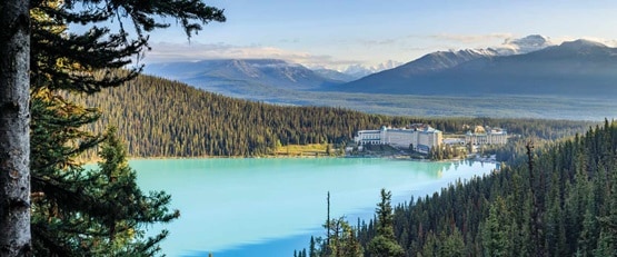 View of Lake Louise with mountains and chateau in background.