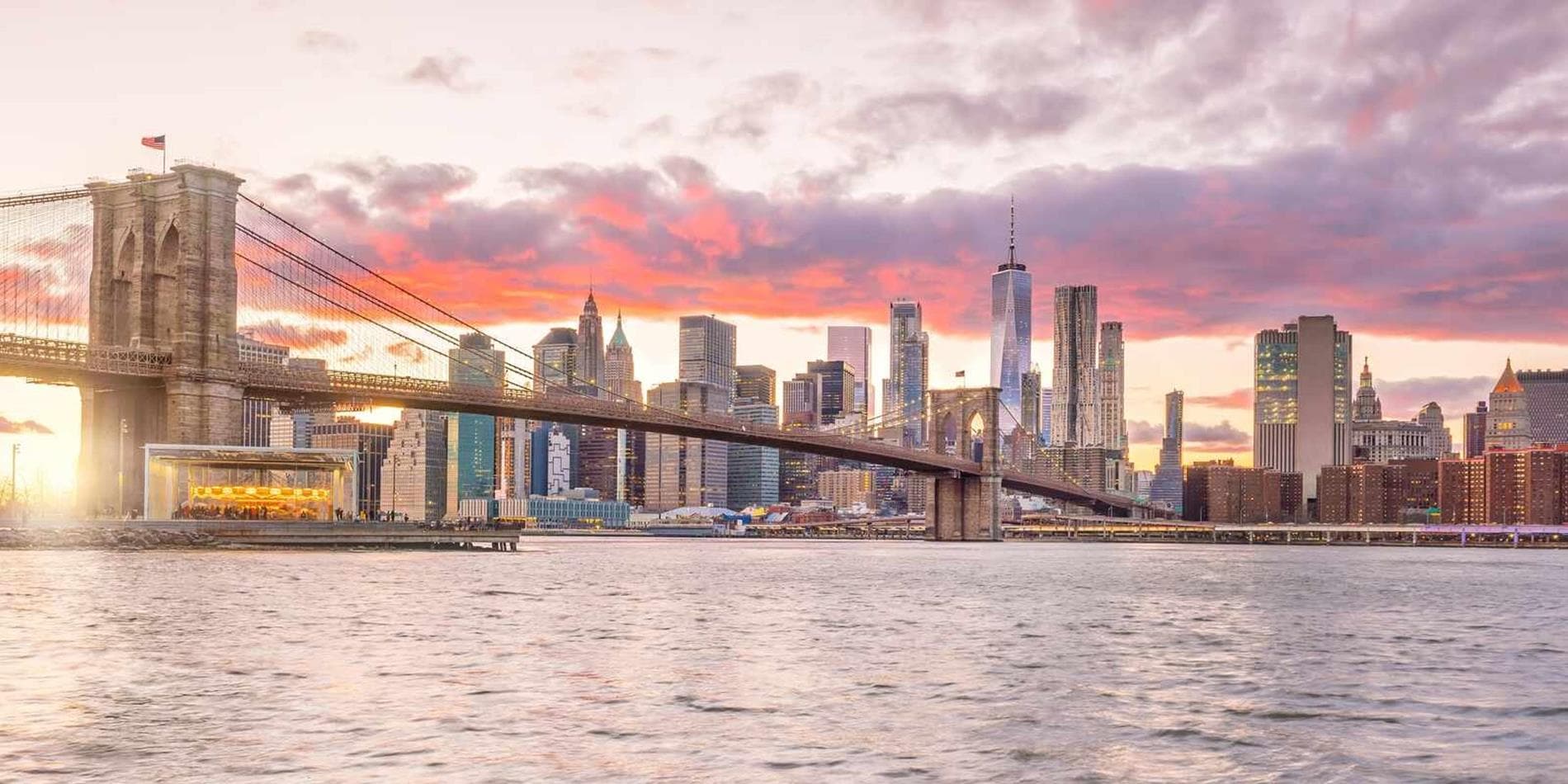 As the sunsets over Brooklyn Bridge in New York City