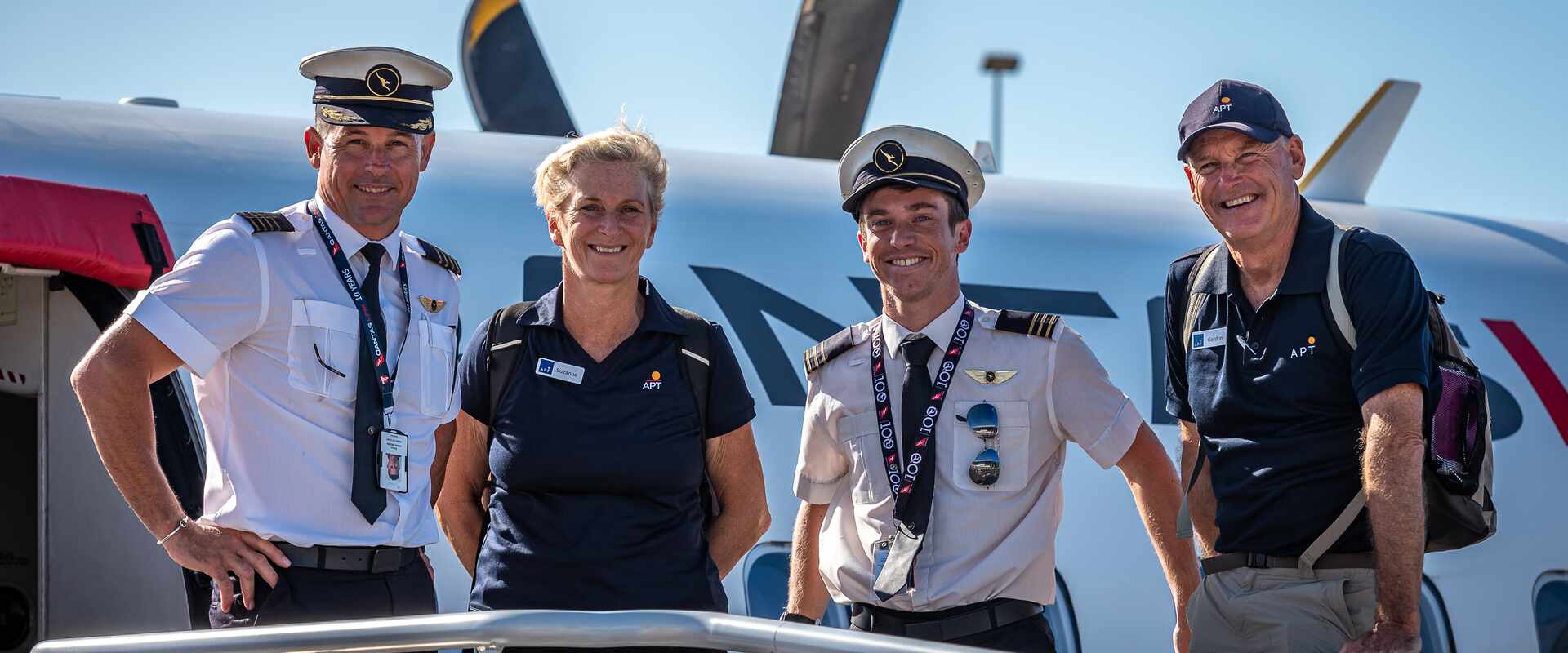 qld flight crew hostess guides boarding flight
